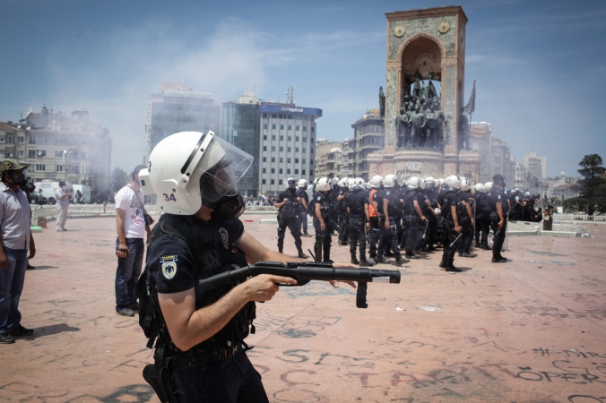 Riot? Check. Gun? Check. Does that mean there's a riot gun in this picture? Read on to find out. (punghi/Shutterstock)