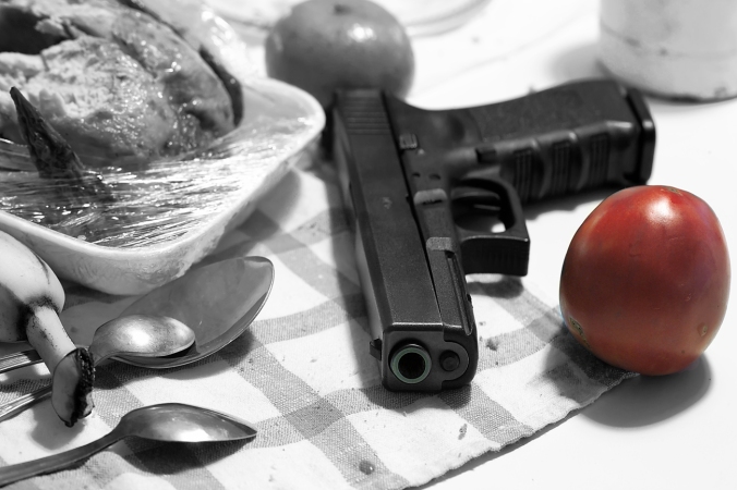 Would you believe there was actually a pic of a gun and a tomato in Shutterstock? I wrote the first paragraph before looking for a pic, and I didn't doctor this photo. Shutterstock is a strange place. (Shutterstock photo)